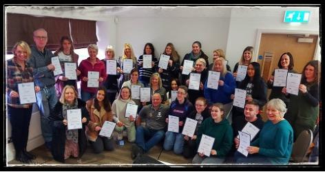 Canine first aiders with their certificates